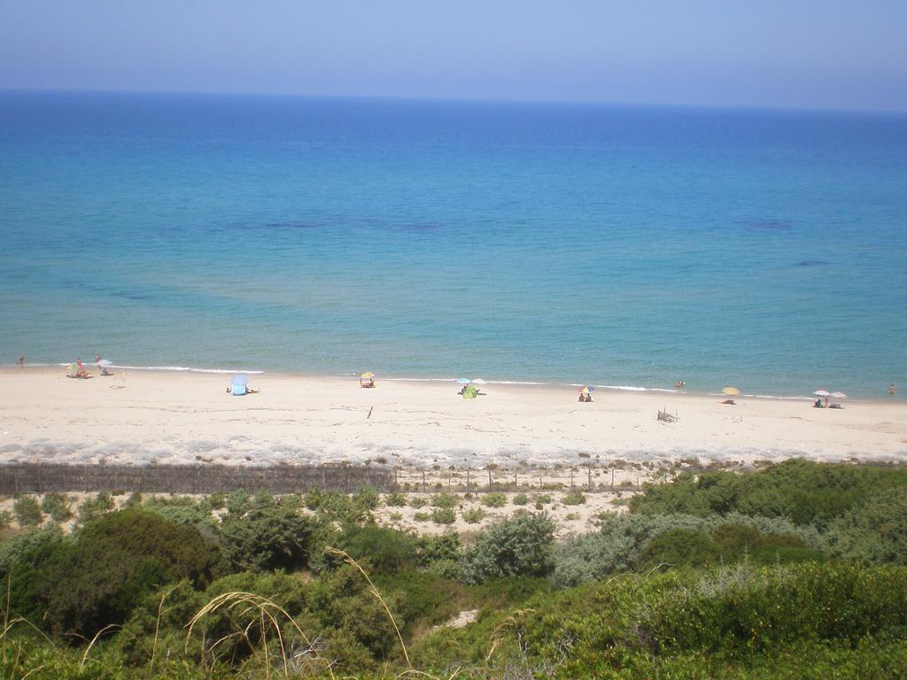 Hotel Corallo Isola Rossa Bagian luar foto