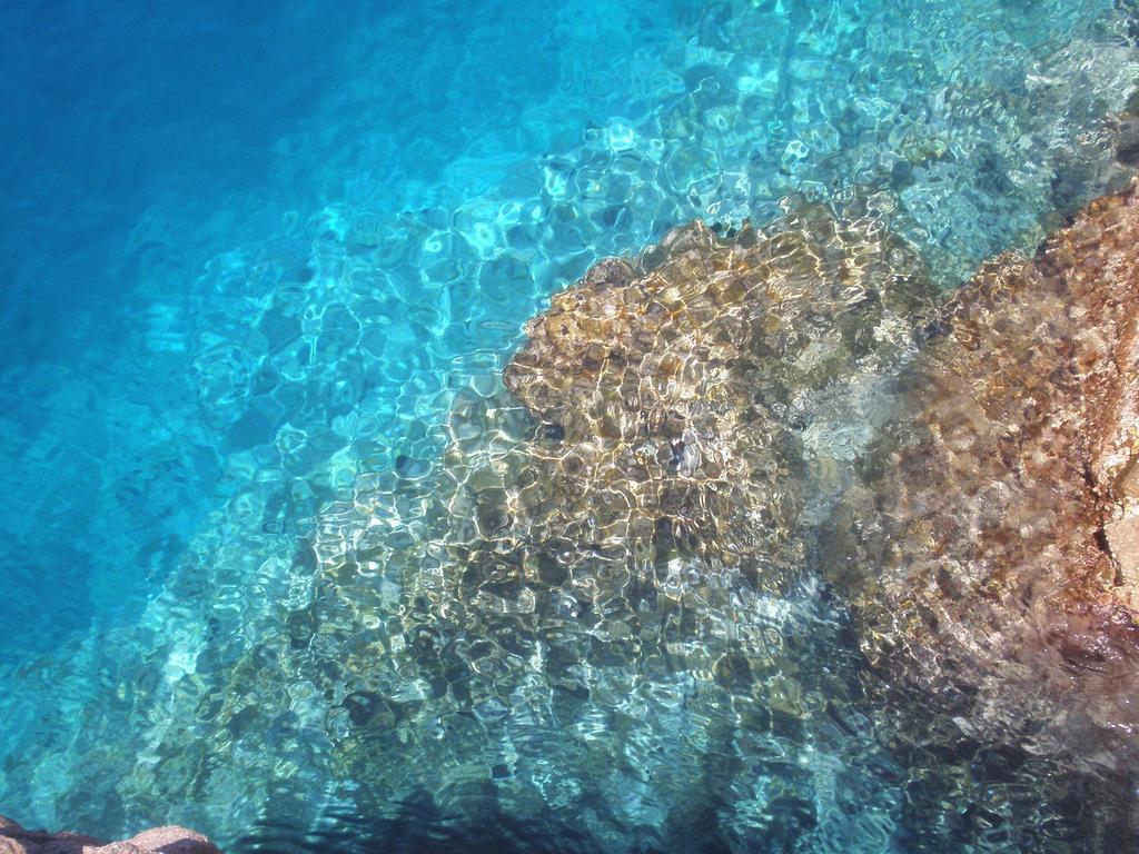 Hotel Corallo Isola Rossa Bagian luar foto